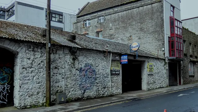 A graffiti-covered laneway in the city
